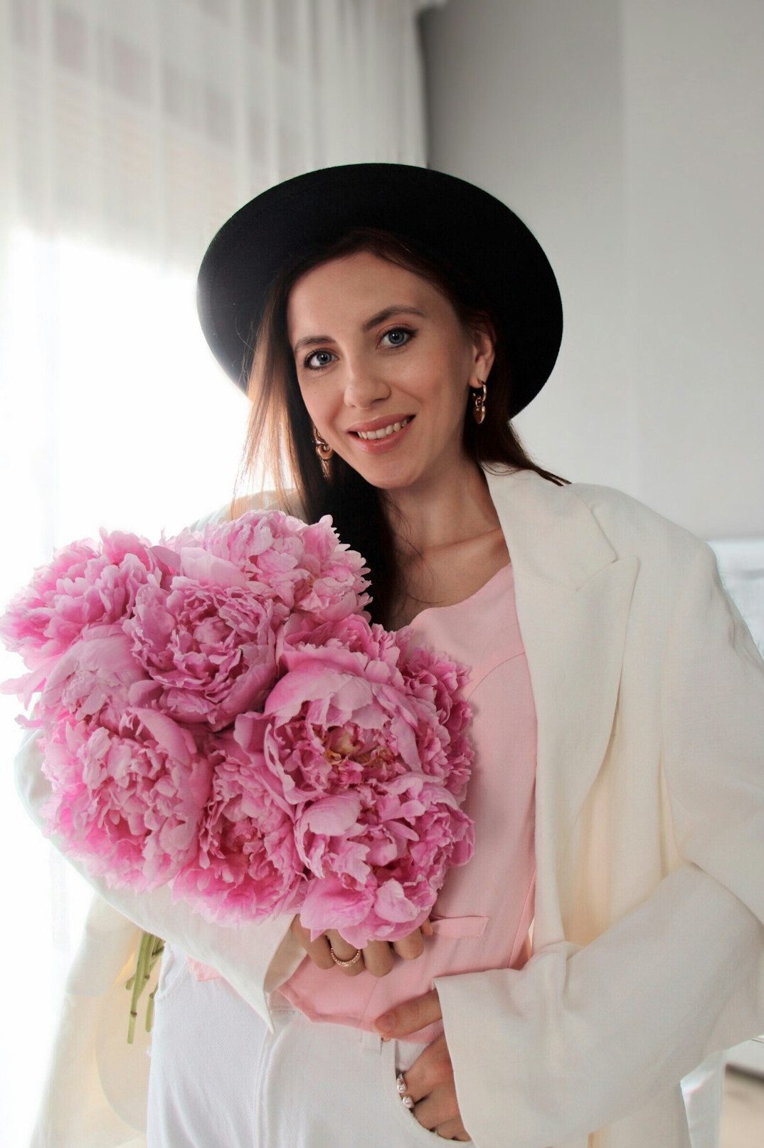 Portrait of a smiling Polish woman editor in a blazer